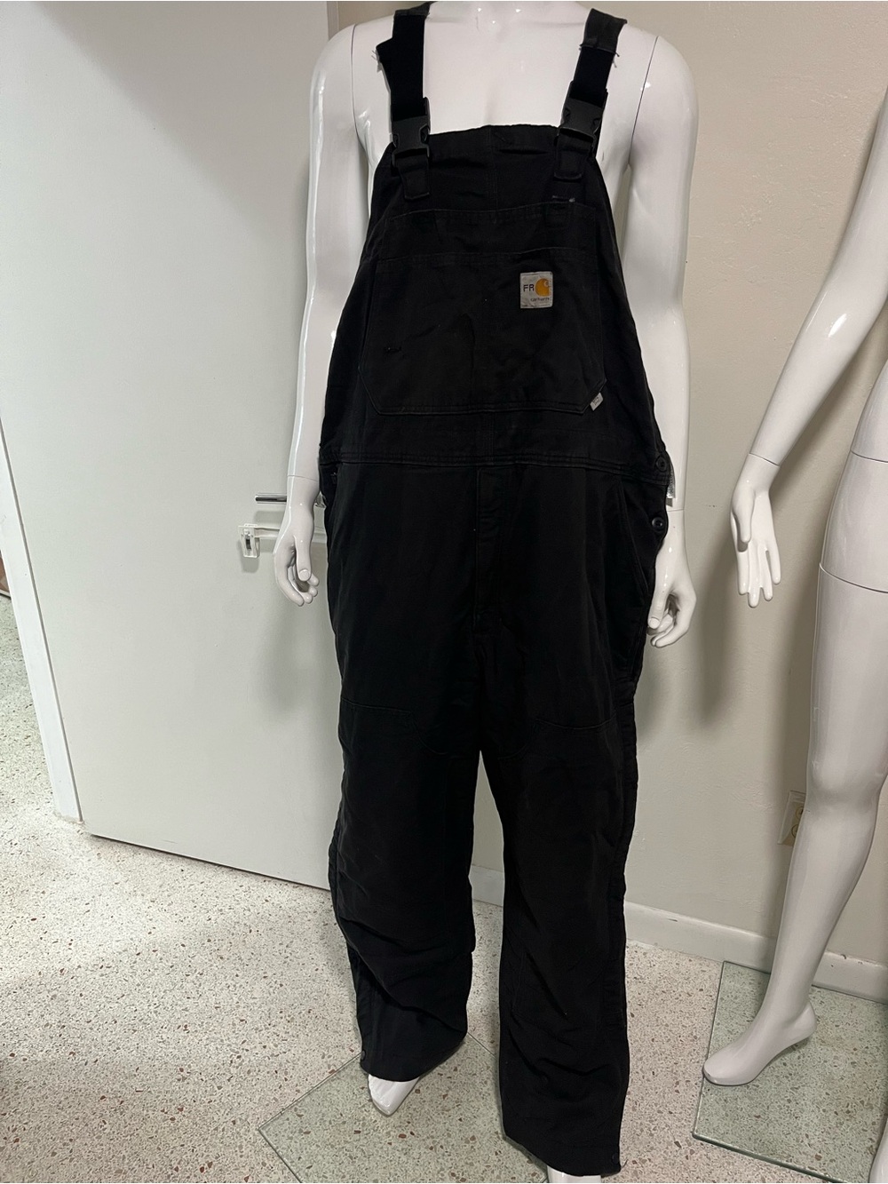 CARHARTT FLAME-RESISTANT DUCK QUILT-LINED BIB OVERALL.